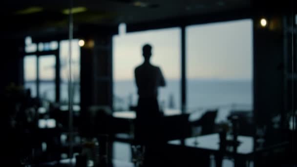 Focused Man Silhouette Looking Beautiful View Dark Panoramic Bar Handsome — Vídeos de Stock