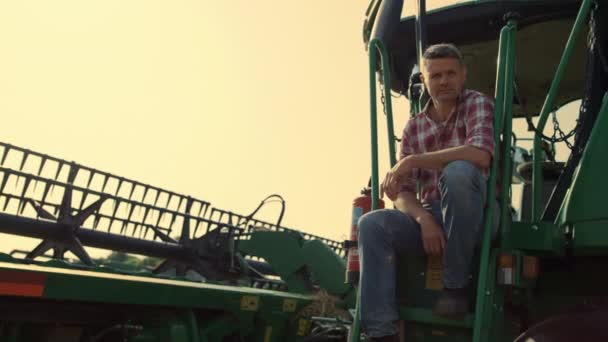 Harvester Driver Resting Field Sunlight Farmer Inspecting Cropping Machinery Sunset — Video