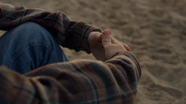 Unrecognizable Man Sitting Sandy Beach Alone Closeup Guy Clasped Hands — стоковое фото