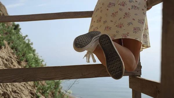 Slim Girl Legs Wearing White Sneakers Front Blue Ocean Close — Zdjęcie stockowe