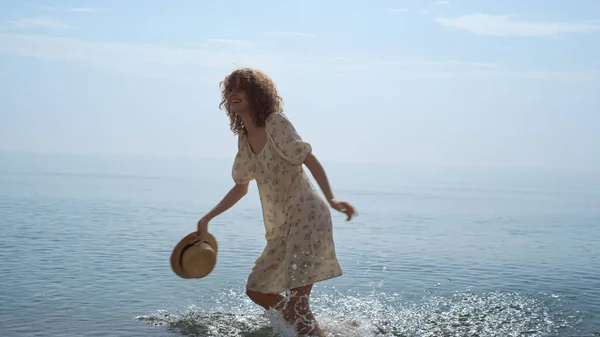 Happy Curly Woman Spinning Bouncing Wet Sand Beach Energetic Cheerful — 图库照片