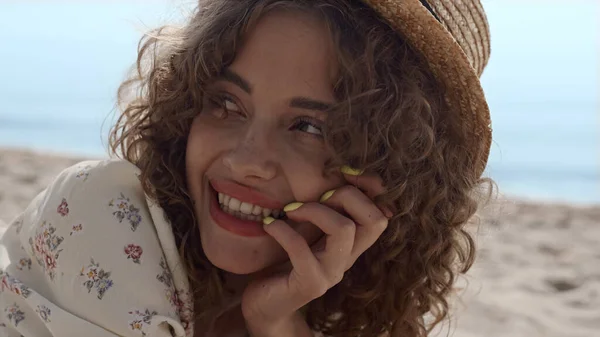 Portrait Smiling Curly Girl Lying Beach Sand Beautiful Summer Day — kuvapankkivalokuva