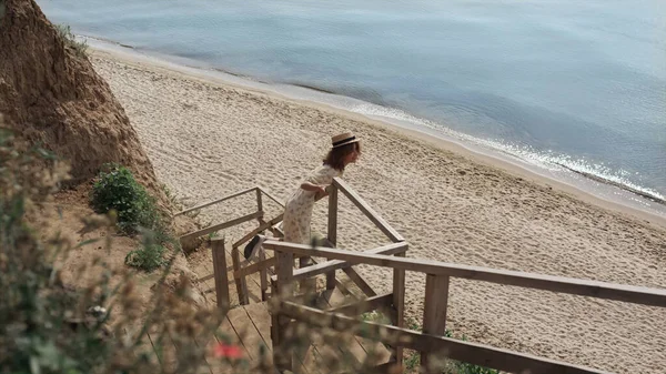 Active Curly Girl Watching Beautiful Seascape Standing Wooden Ladder Empty — Foto de Stock
