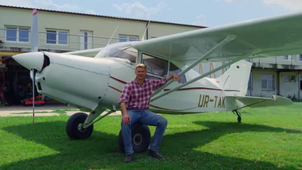 Aviator Posing Sitting Airplane Wheel Smiling Camera Outdoors Flight Trip — 비디오