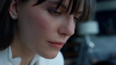 Focused woman thinking about project development alone. Closeup involved supervisor working thinking in luxury office. Attentive businesswoman reading formal letter checking documents at hotel 