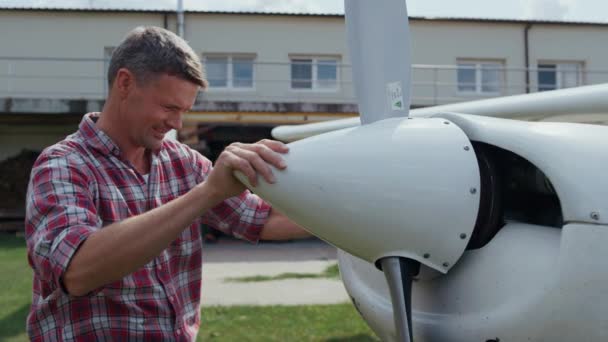 Aviator Fixing Airplane Propeller Smiling Enjoying Preflight Process Aerodrome Close — ストック動画