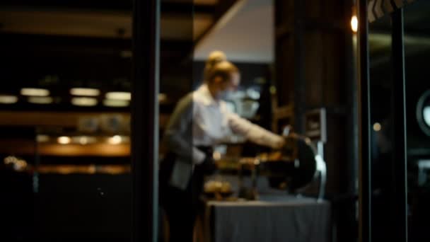Masked Hostess Working Dark Restaurant Interior Alone Elegant Waitress Setting — Vídeo de stock