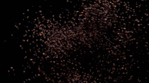 Super Slow Motion Roasted Coffee Grains Exploding Flying Away Closeup — Stock Photo, Image
