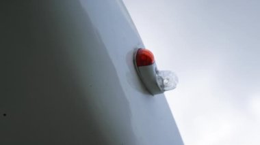 Closeup small airplane part on wing white ultralight parked private plane. Close up detail lightweight white airplane on aerodrome waiting for taking off. Aviation engineering mechanic concept.