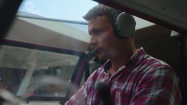Middle Age Airman Starting Airplane Engine Sitting Cockpit Headphones Head — Vídeo de Stock