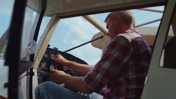 Serious Pilot Checking Control Panel Steering Wheel Modern White Airplane — ストック動画