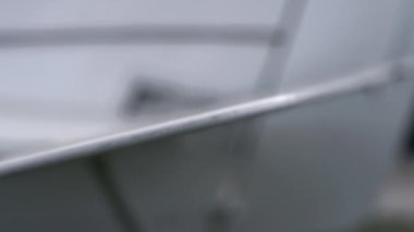 Closeup white airplane wing of personal small lightweight plane parked on airdrome. Private ultralight aircraft back flaps regulation on airfield after landing. Modern air transport components concept