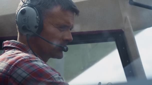 Portrait Professional Aviator Wearing Headset Aircraft Cockpit Analyzing Plane Condition — Stockvideo