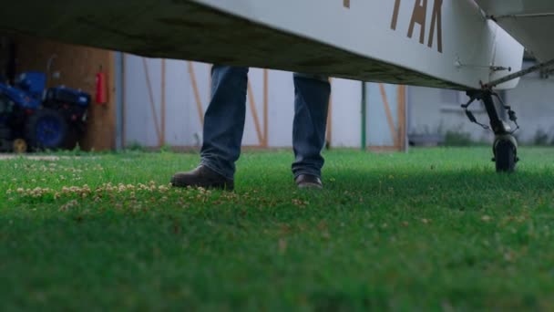 Closeup Pilot Legs Wearing Jeans Walking Green Grass Plane Ready — Stockvideo
