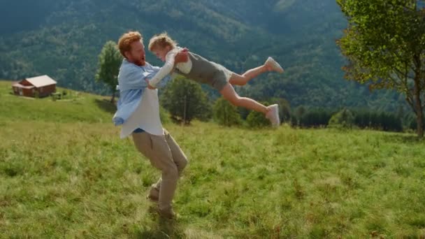 Playful Ginger Father Circling Daughter Arms Sunny Day Standing Green — Stock Video