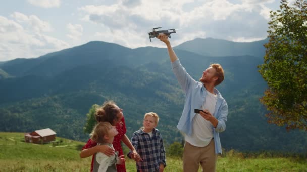 Happy Family Using Drone Walk Summer Mountains Red Hair Man — 图库视频影像