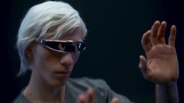 Metaverse man hand touching virtual global internet connection space. Male person VR glasses exploring analyzing invisible videogame world closeup. Big data and future digital technology concept 