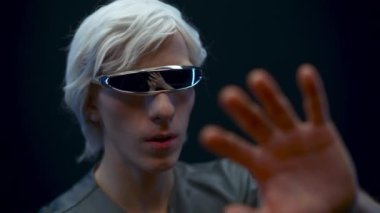 Involved man touching considering VR technologies closeup. Amazed user headset exploring metaverse, examining checking virtual reality subjects slow motion. Digital modern high-tech world concept 