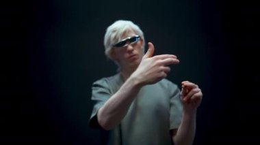 Inspection man swiping invisible image in digital glasses. Closeup futuristic specialist checking clicking hands on virtual screen. Millennial guy enjoying videogame. Technology, interface concept