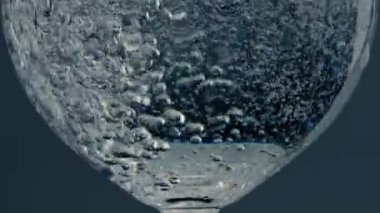 Closeup bubbles rising glass surface at dark background. Fresh pure beverage in transparent glassware. Crystal clear fluid splashing in beautiful wine jug. Refreshing sparkling drink in cup concept.