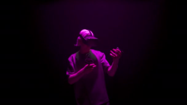 Gamer Enjoying Virtual Reality Neon Light Focused Man Using Console — 图库视频影像