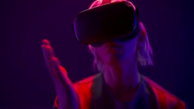 Metaverse man VR glasses playing videogame closeup. Serious male person exploring virtual global internet connection space Youngster analyzing 3d world. Big data and future digital technology concept
