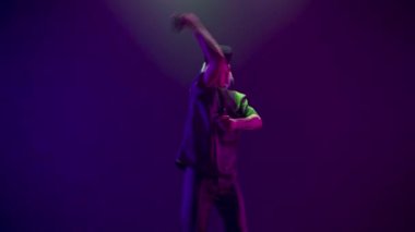 Concentrated person practicing fencing exercising using VR headset. Youngster man defending from enemies training at simulator competition game slow motion. Futuristic network experience concept 