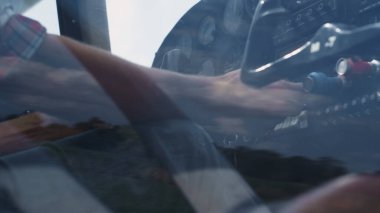 Unknown pilot sitting plane cabin controlling airplane condition analysing indicators data closeup. Airman hands pressing buttons control panel in cockpit doing preflight check before taking off. 