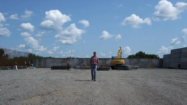 Construction Inspector Checking Build Process Walking Yellow Excavator Outdoors Professional — Photo