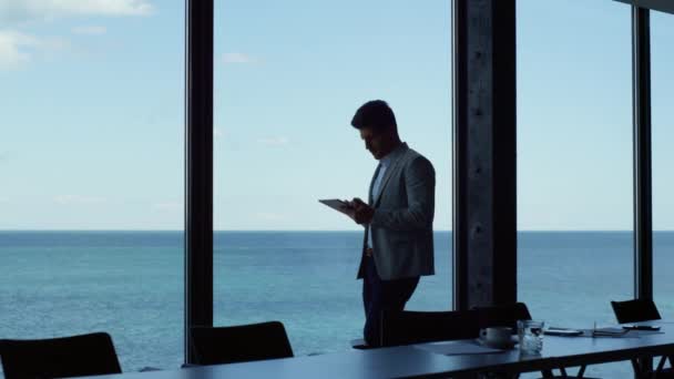 Thinking Businessman Using Tablet Panoramic Window Office Executive Standing Working — Stock video