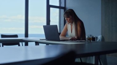 Corporate manager analyzing data online report. Focused businesswoman look idea solution in office room. Financial director freelancer reading searching information. Thinking ceo considering problem.