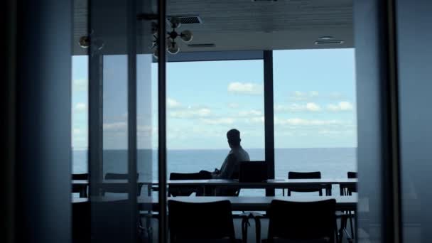 Businessman Silhouette Resting Sea Dark Office Company Intern Looking Window — Video