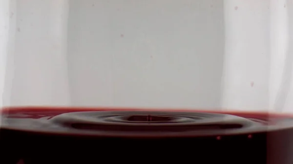 Red Wine Dripping Glass Closeup Smooth Grape Liquid Surface Rippling — 스톡 사진