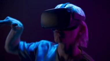 Metaverse man VR glasses playing videogame closeup. Serious male person exploring virtual global internet connection space Youngster analyzing 3d world. Big data and future digital technology concept