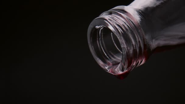 Closeup Red Wine Drops Falling Glass Bottle Neck Super Slow — Stock Video