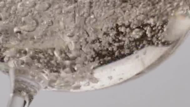 Sparkling Wine Fizzing Clear Glass Bottom Close Golden Champagne Bubbling — Stock Video