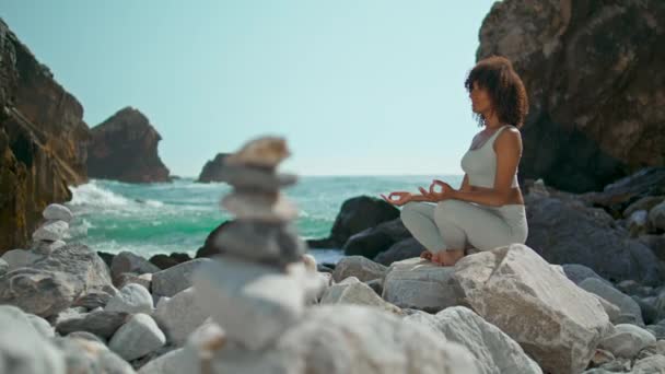 Serene Woman Meditating Lotus Pose Sitting Stone Beautiful Ursa Beach — Stock Video
