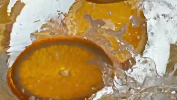 Orange Slices Falling Glass Liquid Closeup Making Fizzy Citrus Cocktail — Stock Video