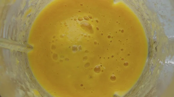 Top View Yellow Fruit Smoothie Splashing Blender Bowl Super Slow — Stock Photo, Image