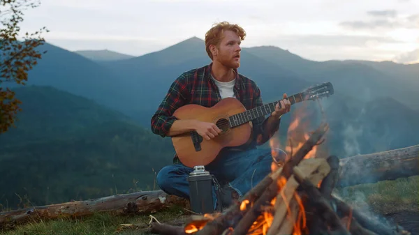 Thoughtful Traveler Play Guitar Outdoors Guy Sit Mountains Nature Campfire — Fotografia de Stock