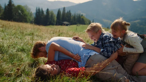 Joyful Family Lying Green Grass Piled Each Other Sunny Day — Stockfoto