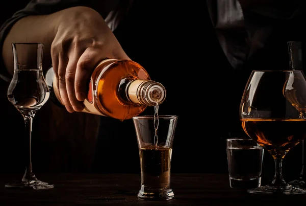 Bartender Pours Golden Tequila Shot Glass Old Wooden Bar Counter — Stock Photo, Image