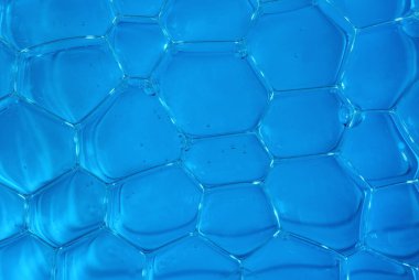 Air bubbles texture close up on blue background. Backgrounds and textures