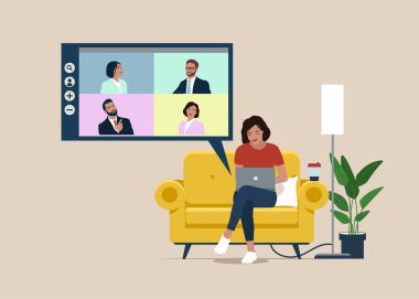 Freelancer sitting on sofa. Workplace at home or modern coworking interior. Video conference, teamwork. Online meeting work form home.