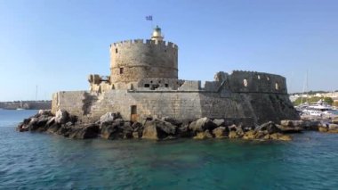 Ancient tower guarding the port entrance. Rhodes, Greece.