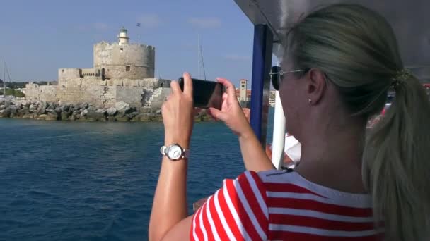 Female Tourist Takes Ancient Tower Smartphone View Moving Ship Rhodes — Wideo stockowe