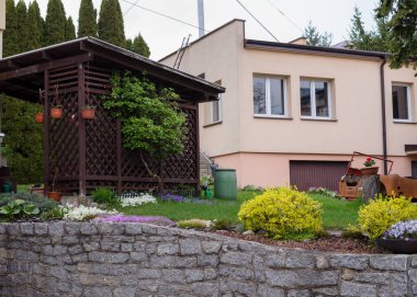 Beautiful landscape design in the courtyard of a private house in spring