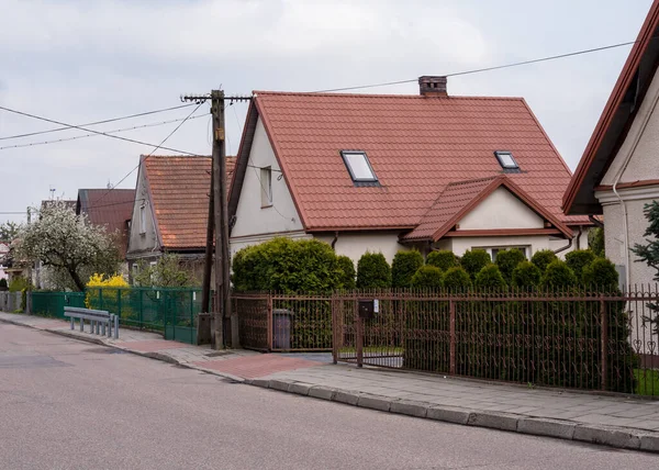 Street private sector in the spring. Street with small beautiful houses and landscaping, landscaping in Europe