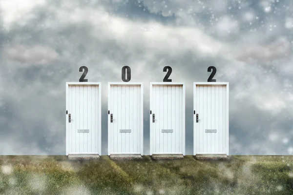 Doors with numbers 2022. Cloudy sky. Snow. Welcome to the new year 2022.New discoveries. New plans. New Year concept.