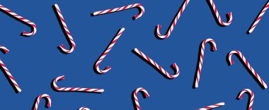 Koyu mavi arka planda yeni yıl şekerleri. Noel arkaplanı. Bayram afişi. Neşeli arkaplan.